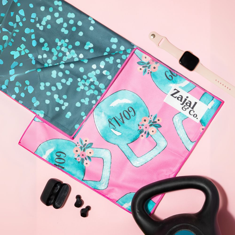 gym_towel_and_accessories_with_teal_background_flatlay