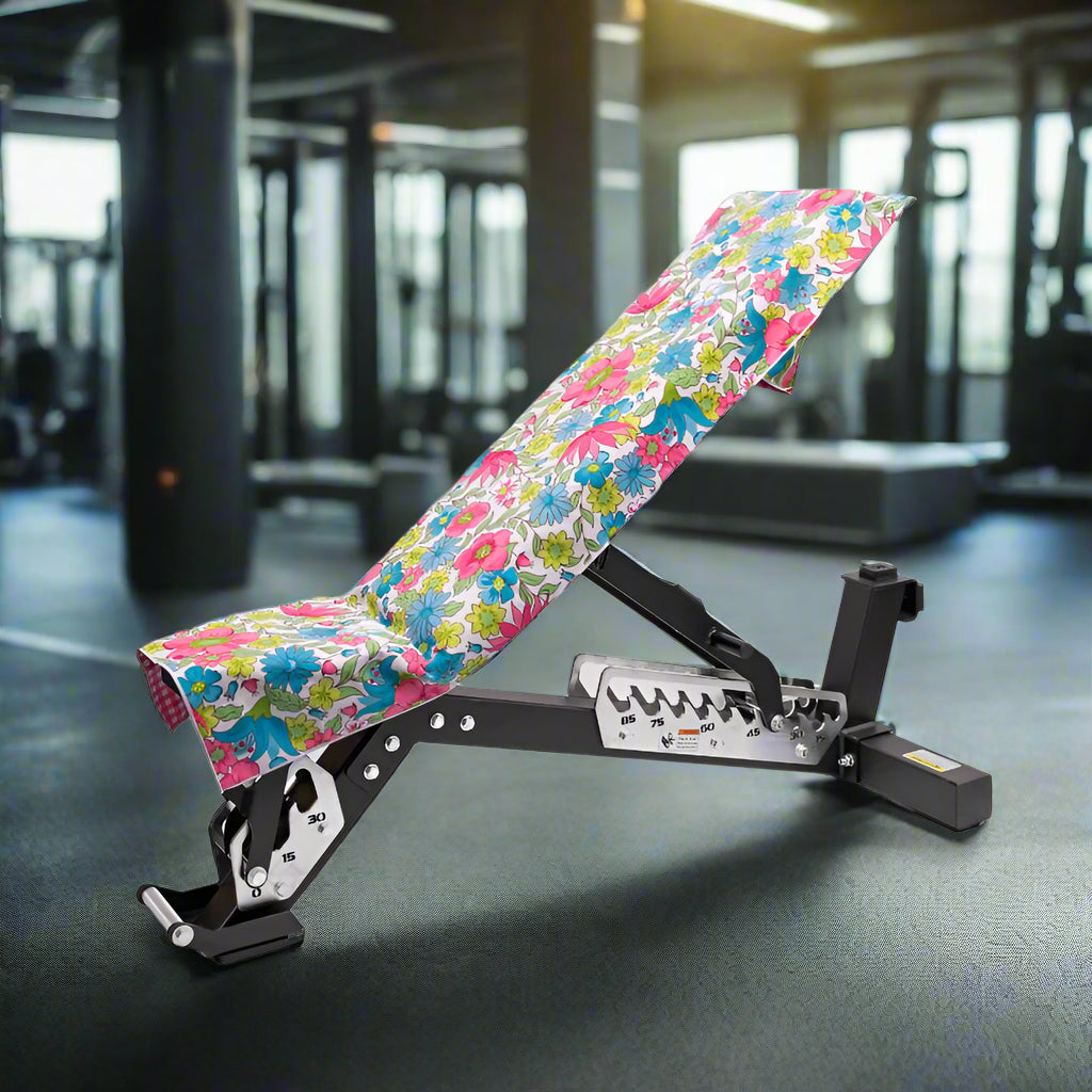 hooded_gym_towel_with_floral_print_on_gym_bench