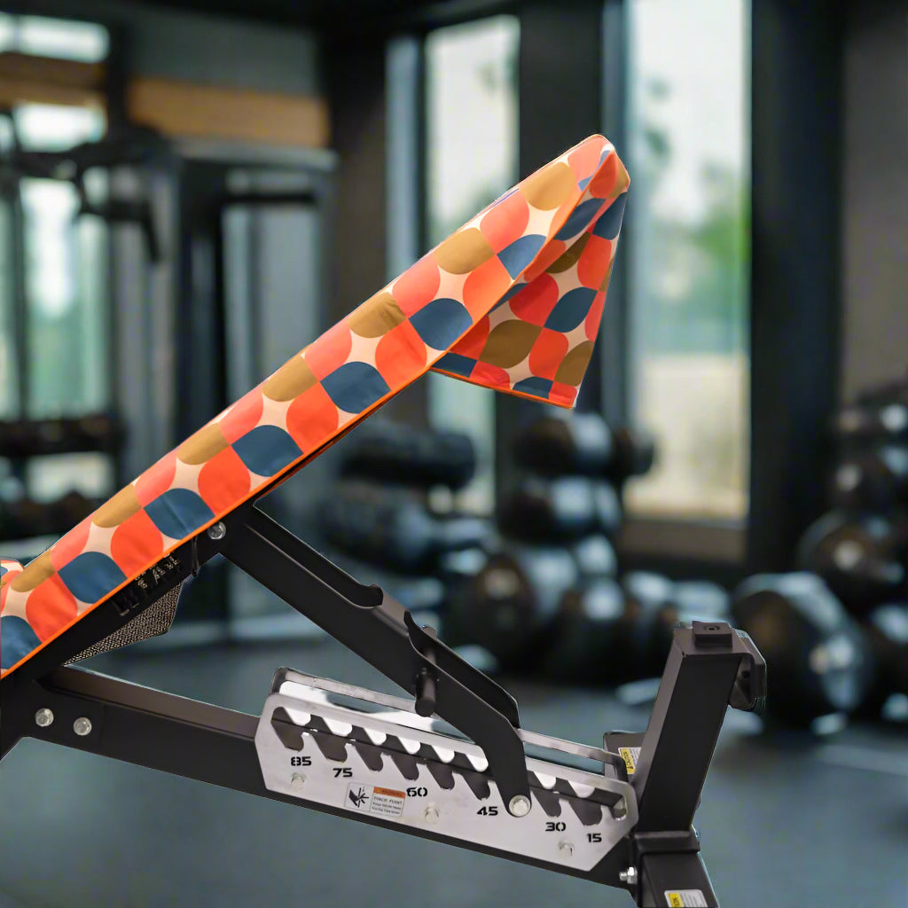 sleek_fitness_bench_with_circular_orange_graphics